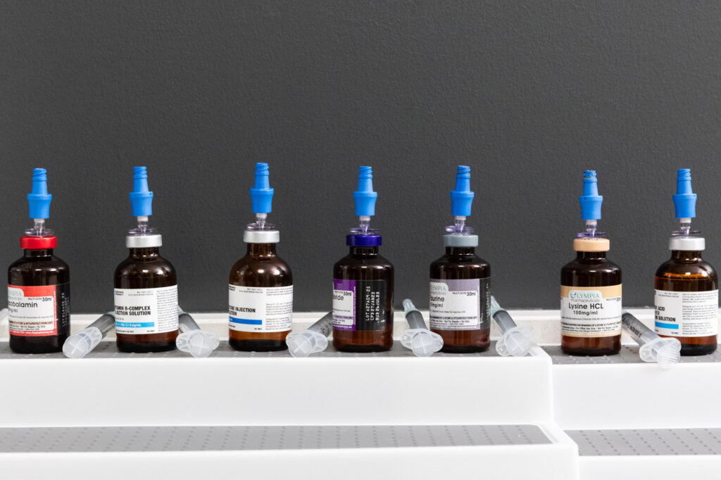 A row of vials with containing different vitamin and nutrients showcases the customization options of IV therapies near Kansas City
